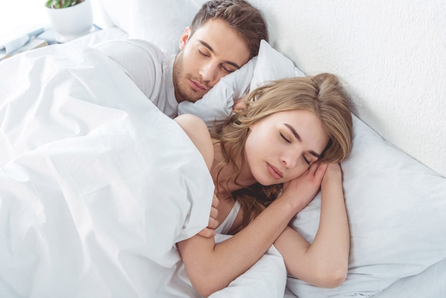 SnoreLessNow-couple-sleeping